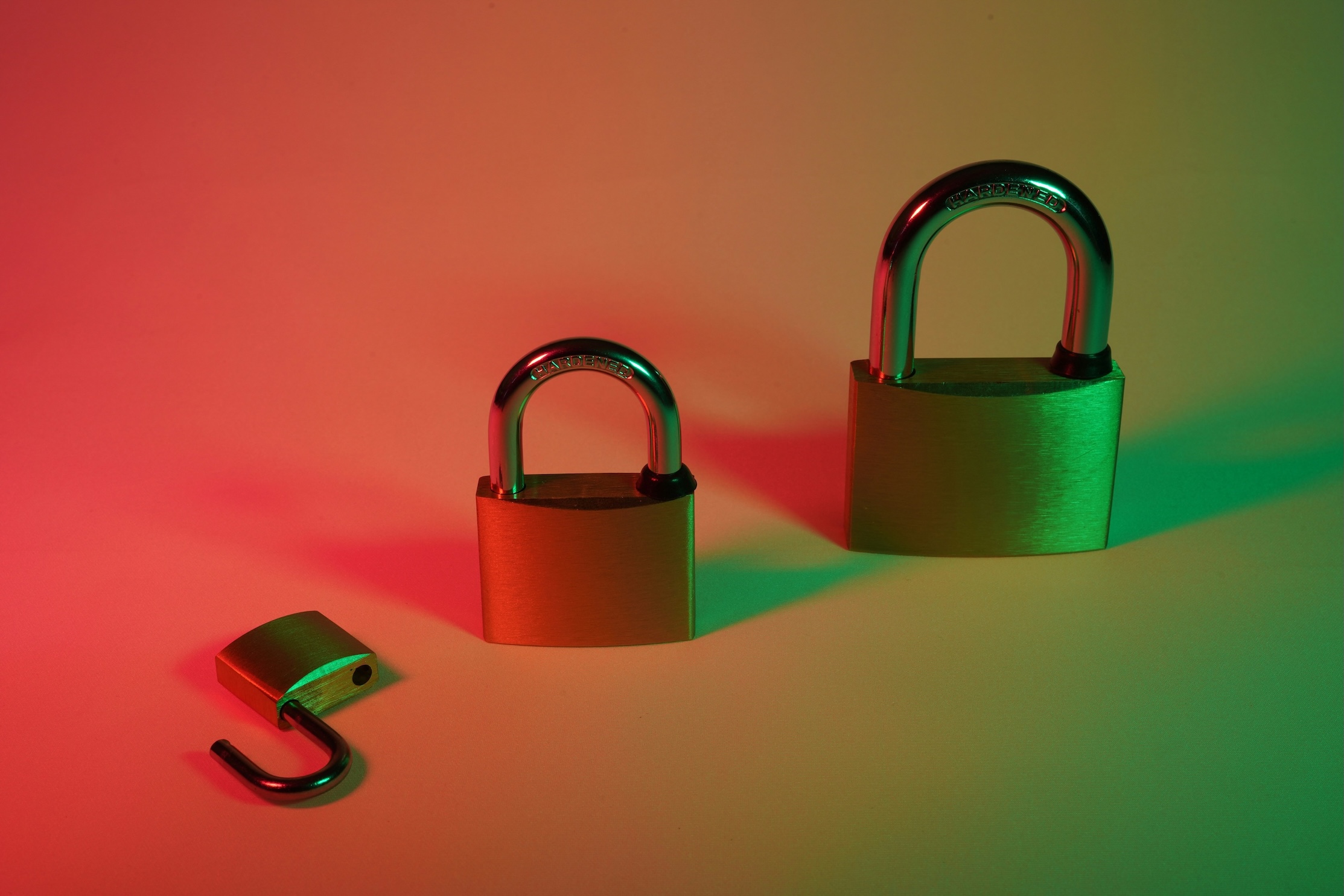 an unlocked and locked padlock