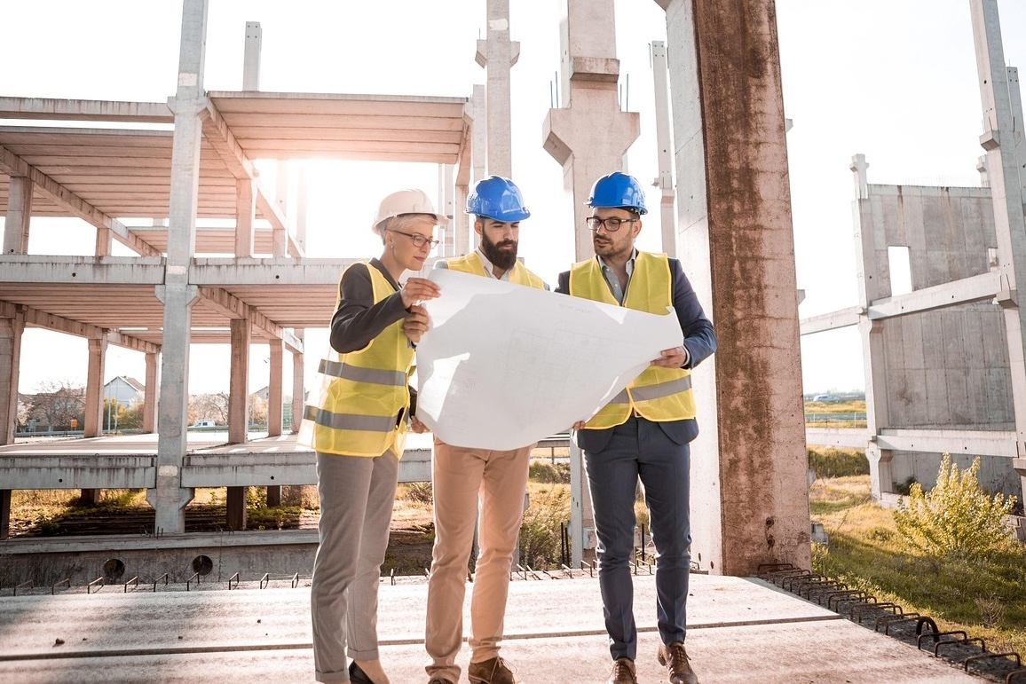 architects holding a blueprint