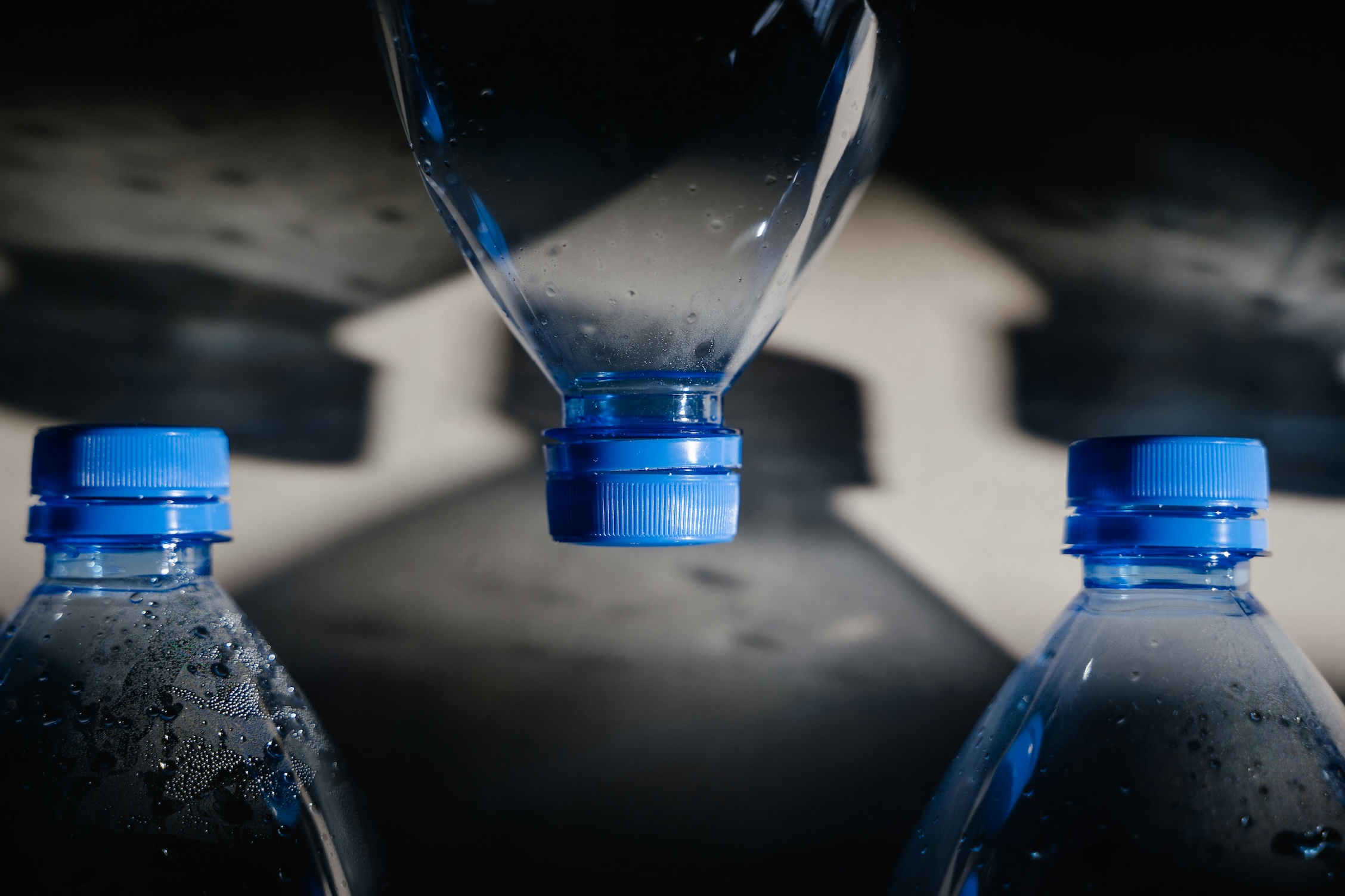 three empty plastic bottles