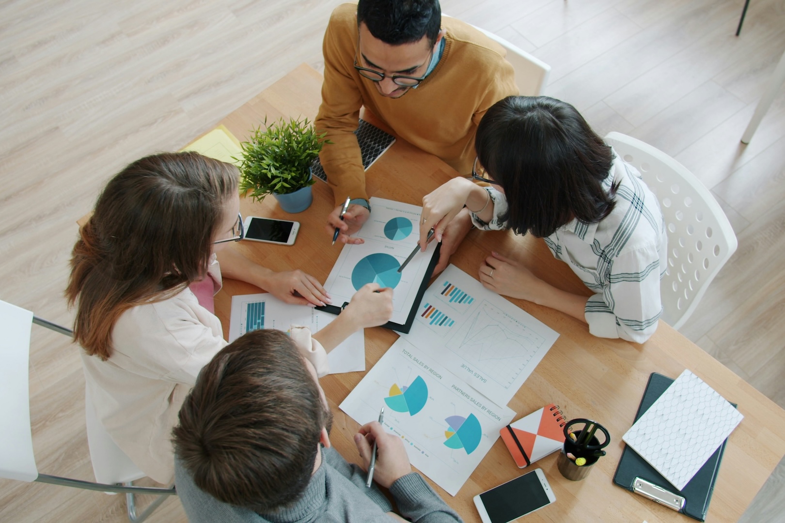 a team at a table discussing a project 