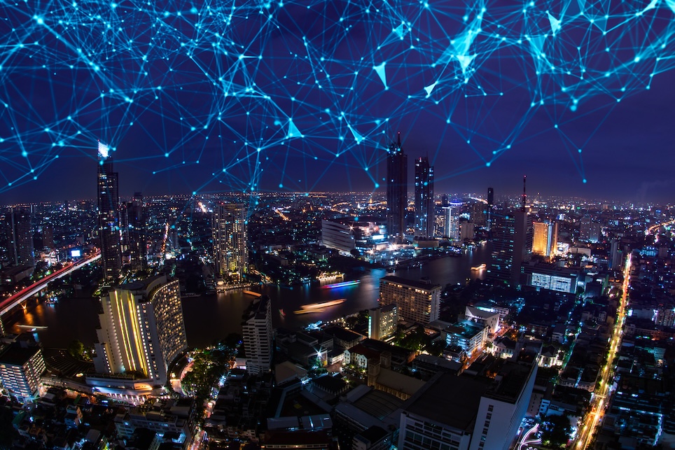 internet of things communication depicted in a city night sky