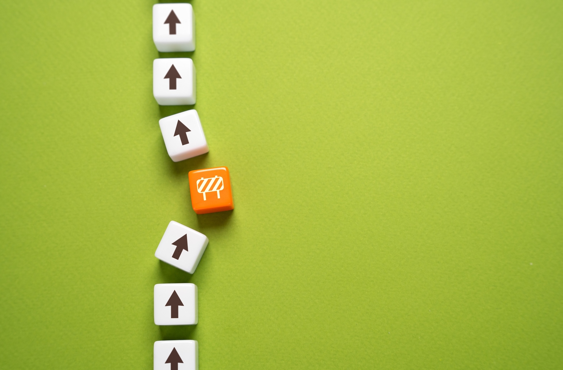 a row of cubes with a roadblock cube in the middle
