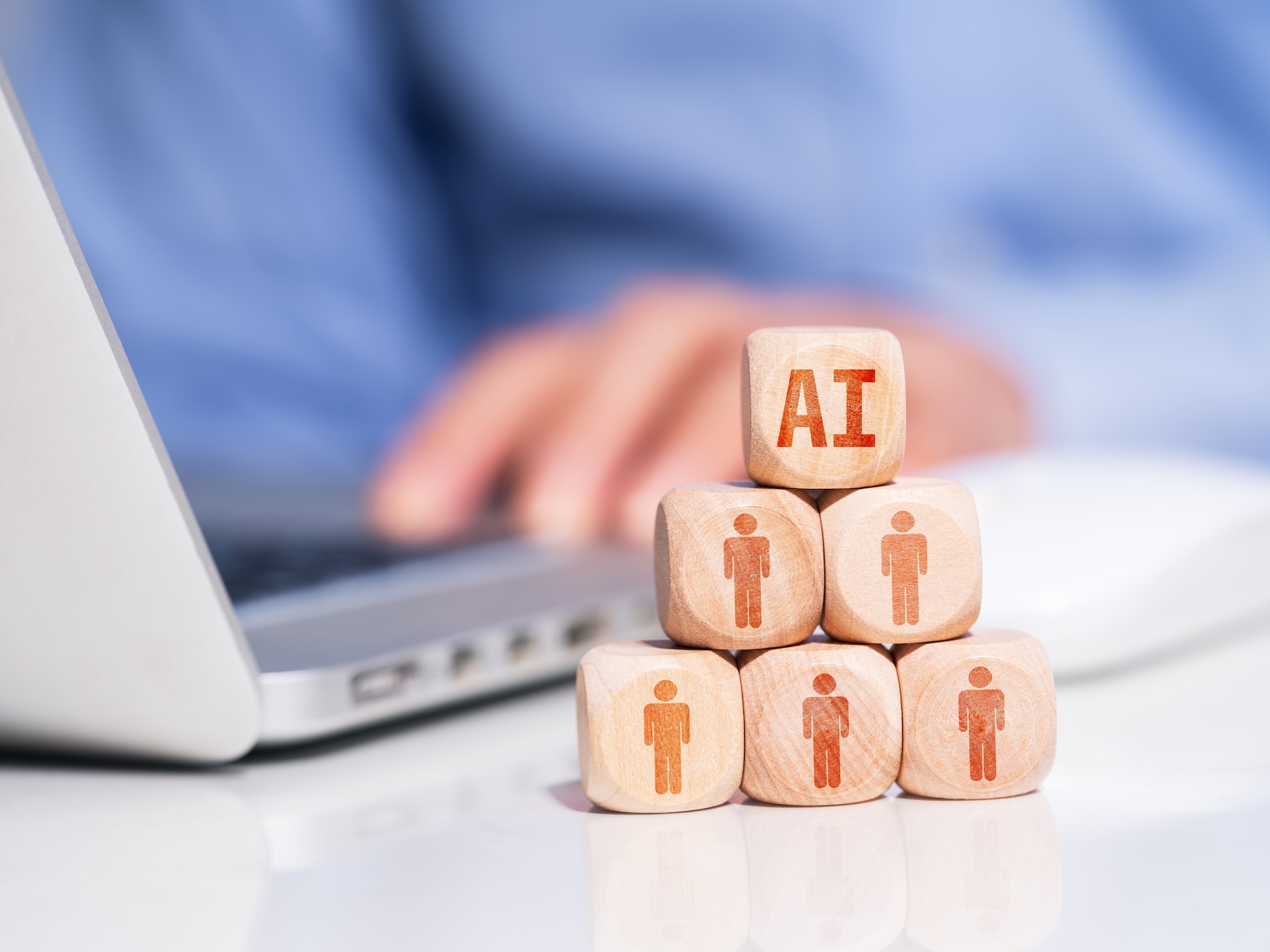 ai building blocks next to a laptop