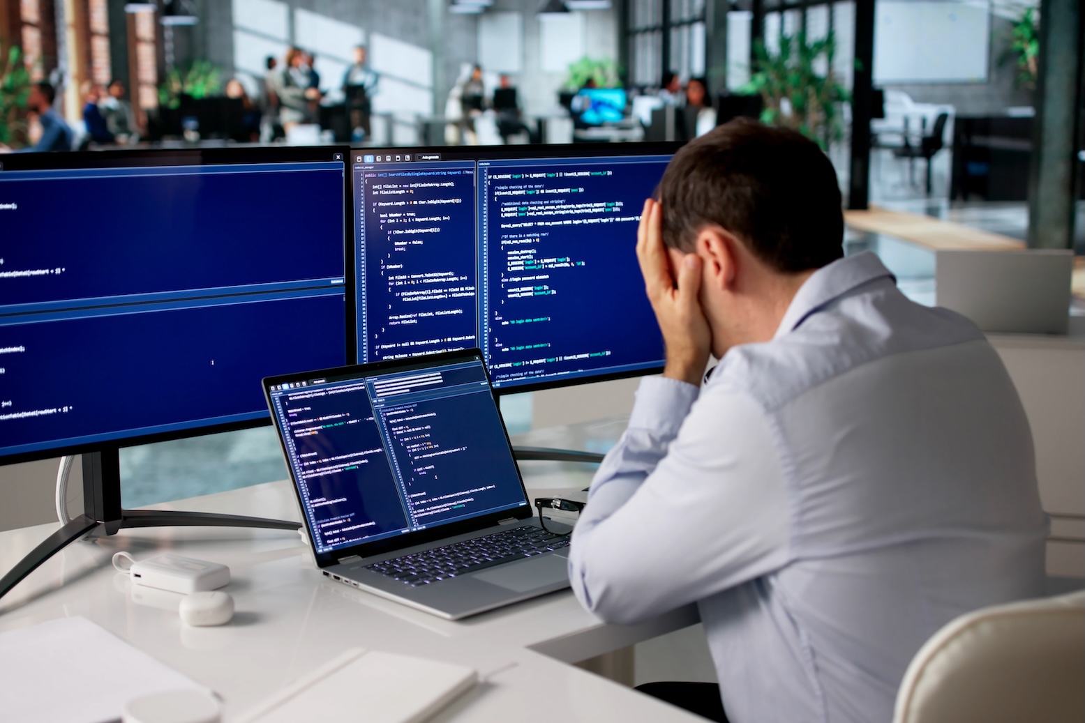 frustrated developer sitting at his desk