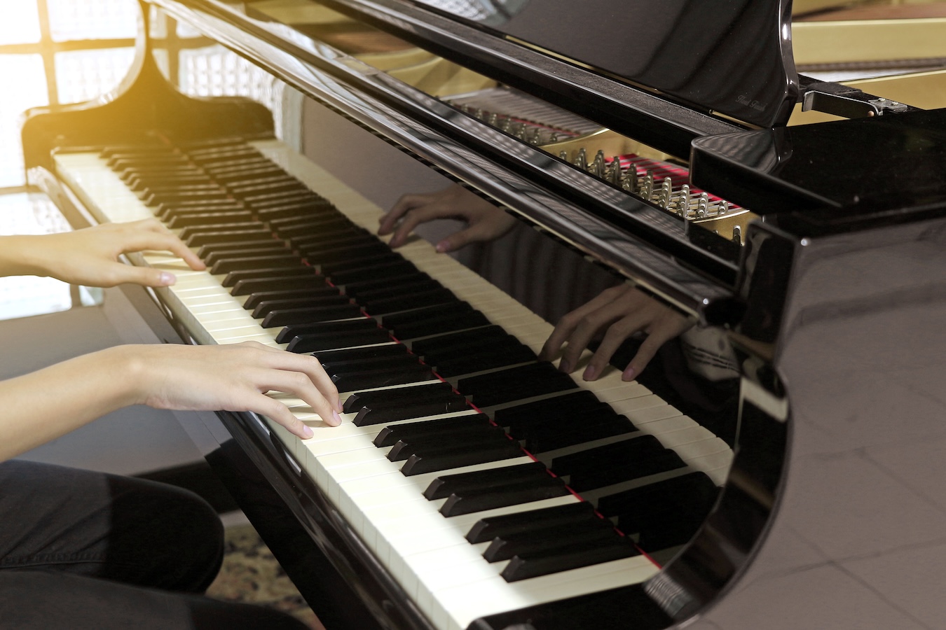 piano player playing a piano