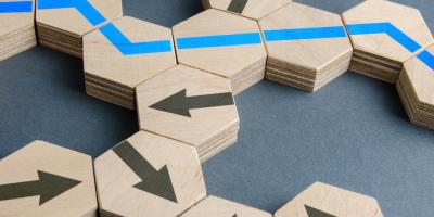 arrow blocks scattered on the floor with blue pathway