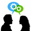 two people with gears moving above heads