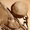 Sisyphus pushing boulder up a hill