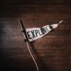 Flag that says "Explore," photo by Andrew Neel