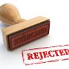 Red rubber stamp that says "Rejected"