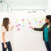 Members of a Scrum team discussing backlog items for the next sprint