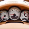 Car dashboard with various meters and dials