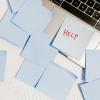 post-it notes scattered on a laptop