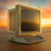 old computer behind a sunset