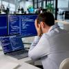 frustrated developer sitting at his desk