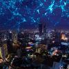 internet of things communication depicted in a city night sky