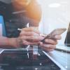 person doing quality assurance testing on a smartphone